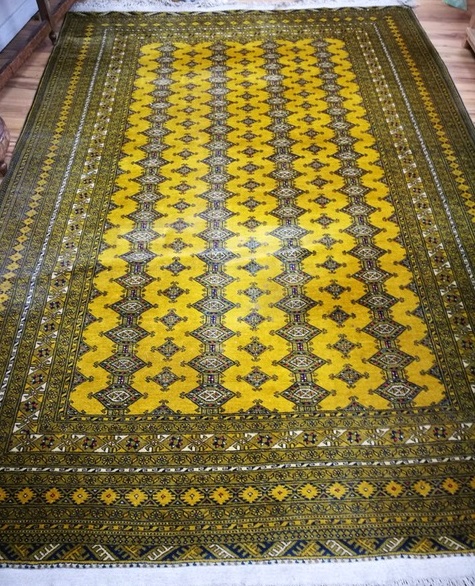 A mustard ground carpet 330 x 220cm